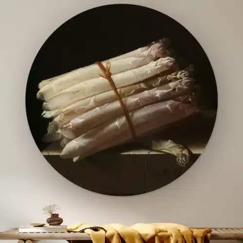 Muurcirkel Stilleven met asperges van Adriaen Coorte aan de muur boven een houten bank met een okergele plaid
