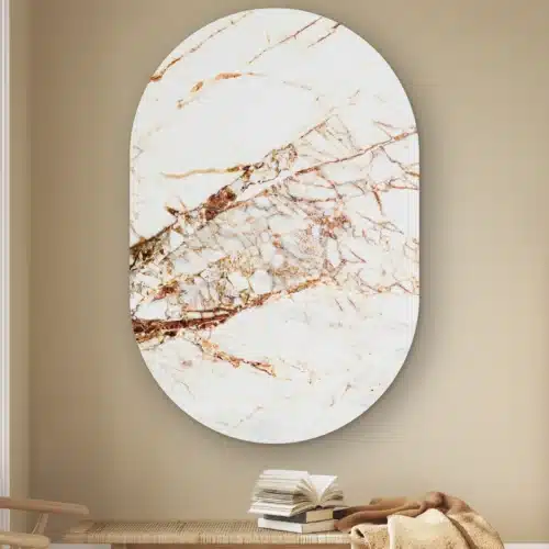 Muurovaal Rose gouden marmer aan de muur boven een houten bankje met boeken