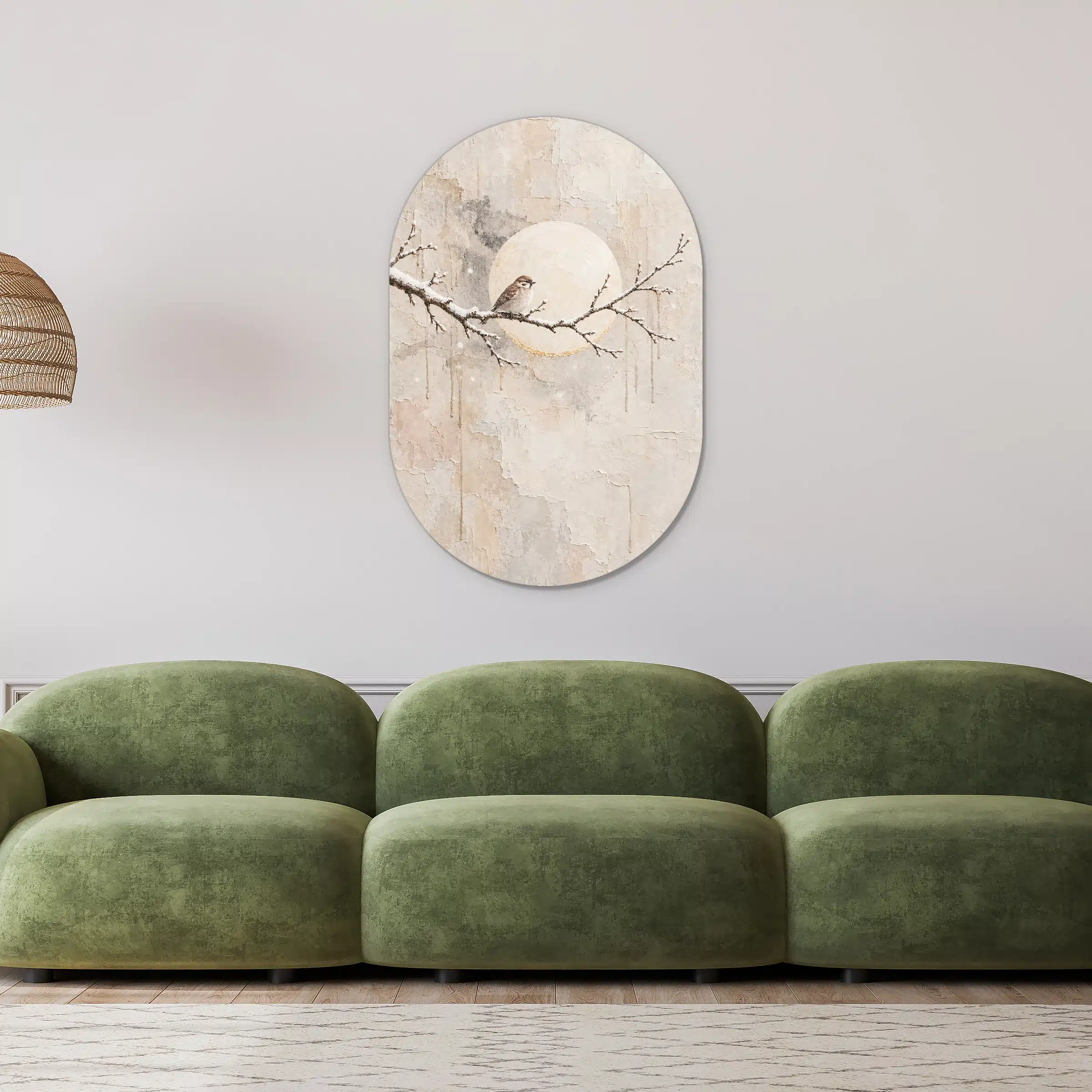 Schilderij maan als muurovaal in een lichte woonkamer boven een groene bank